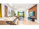 Spacious living room with modern furniture, an open layout, and abundant natural light at 7219 Oakmoss Loop, Davenport, FL 33837