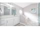 Bathroom featuring a glass shower, a soaking tub, wood-look tile, and modern fixtures at 738 Paris Dr, Kissimmee, FL 34759