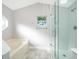 Modern bathroom featuring a glass shower, separate tub, and bright natural light at 738 Paris Dr, Kissimmee, FL 34759