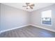 Neutral bedroom featuring luxury vinyl plank flooring and a bright window at 738 Paris Dr, Kissimmee, FL 34759