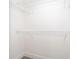 Walk-in closet with a bright white interior and wire shelving for optimal storage solutions at 738 Paris Dr, Kissimmee, FL 34759