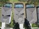 Aerial view of the property with a screened pool, showcasing privacy and neighborhood layout at 7709 Comrow St, Kissimmee, FL 34747