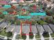 Aerial view shows the property's proximity to the community's basketball, tennis, and BBQ areas at 7709 Comrow St, Kissimmee, FL 34747