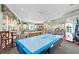Spacious game room features air hockey, pool tables, arcade games, and comfortable seating at 7709 Comrow St, Kissimmee, FL 34747
