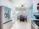 Eat-in kitchen area featuring lots of natural light, modern appliances and a breakfast table with seating at 7709 Comrow St, Kissimmee, FL 34747