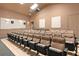 Inviting theater featuring tiered seating, sconce lighting, and audio visual system at 7709 Comrow St, Kissimmee, FL 34747