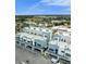 Aerial view of modern townhomes featuring balconies and manicured landscaping at 871 City Walk Ln # B-1, Oviedo, FL 32765
