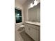 This bathroom has a vanity with granite countertop at 871 City Walk Ln # B-1, Oviedo, FL 32765