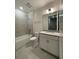 Clean bathroom featuring tub, toilet and sink with modern finishes at 871 City Walk Ln # B-1, Oviedo, FL 32765