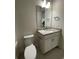 Clean bathroom features a white vanity and granite countertop at 871 City Walk Ln # B-1, Oviedo, FL 32765