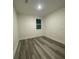 This bedroom features neutral walls and vinyl wood-look flooring at 871 City Walk Ln # B-1, Oviedo, FL 32765