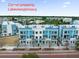 Modern townhome exterior boasting a corner lot with lake view, gray and blue color scheme and small, personal balcony at 871 City Walk Ln # B-1, Oviedo, FL 32765