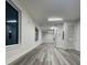 Large living area with modern flooring, white walls, and recessed lighting at 871 City Walk Ln # B-1, Oviedo, FL 32765