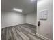 Large living area with modern flooring, white walls, and recessed lighting at 871 City Walk Ln # B-1, Oviedo, FL 32765