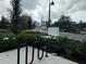 Exterior shot featuring mailboxes with landscaping and sidewalk at 871 City Walk Ln # B-1, Oviedo, FL 32765