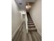 A bright stairway with carpeted steps and laminate flooring at 871 City Walk Ln # B-1, Oviedo, FL 32765