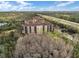 Stunning aerial view of a building in a community near major highways and lush wooded areas at 8762 Worldquest Blvd # 6506, Orlando, FL 32821