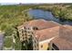 Birds eye view featuring the building's architecture, landscaping, and lake views at 8762 Worldquest Blvd # 6506, Orlando, FL 32821