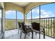 Enjoy the outdoor space with a view from this condo's screened balcony with table and chairs at 8762 Worldquest Blvd # 6506, Orlando, FL 32821