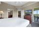 Spacious bedroom with access to a private patio and an en-suite bathroom at 8762 Worldquest Blvd # 6506, Orlando, FL 32821