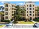 Beautiful condo complex featuring private balconies, manicured landscaping, and convenient parking at 8762 Worldquest Blvd # 6506, Orlando, FL 32821