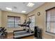 Bright fitness room with treadmills, free weights, and windows for a refreshing workout experience at 8762 Worldquest Blvd # 6506, Orlando, FL 32821