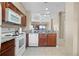 Open-concept kitchen and living area with tile flooring, modern appliances, and plenty of natural light at 8762 Worldquest Blvd # 6506, Orlando, FL 32821