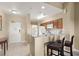 Eat-in kitchen with tiled floors, granite countertops, ample cabinet space, and modern appliances at 8762 Worldquest Blvd # 6506, Orlando, FL 32821