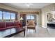 Comfortable living room with a large window, balcony access, and tile flooring at 8762 Worldquest Blvd # 6506, Orlando, FL 32821