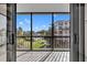 Enjoy spectacular pool views from this lovely screened in balcony with black metal railings and tiled floors at 100 S Interlachen Ave # 304, Winter Park, FL 32789