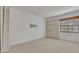 Neutral bedroom with built-in shelving and a large window for ample, natural light at 100 S Interlachen Ave # 304, Winter Park, FL 32789