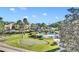Beautiful community featuring a pool, putting green, lush greenery and surrounding residential buildings at 100 S Interlachen Ave # 304, Winter Park, FL 32789