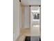 A foyer with stone tile flooring leading into a sunlit living space at 100 S Interlachen Ave # 304, Winter Park, FL 32789