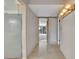 Spacious hallway with tile floors and modern lighting leads to a light filled room at 100 S Interlachen Ave # 304, Winter Park, FL 32789