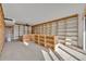 Spacious living room featuring custom bookshelves and ample natural light at 100 S Interlachen Ave # 304, Winter Park, FL 32789