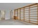 Open-concept living area featuring custom built in bookshelves and bright, natural light at 100 S Interlachen Ave # 304, Winter Park, FL 32789