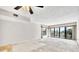 Large living room with sliding glass doors to outside at 100 S Interlachen Ave # 304, Winter Park, FL 32789