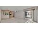 Open living room with kitchen and window view to the outside at 100 S Interlachen Ave # 304, Winter Park, FL 32789