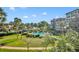 The community pool features lush landscaping, mature palms, and plenty of room to relax at 100 S Interlachen Ave # 304, Winter Park, FL 32789
