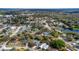 An aerial view shows the neighborhood's houses, green spaces, and lake views at 1005 Leeds Ct, Winter Park, FL 32792