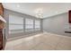 Dining room features tile floor, large windows, and brick fireplace at 1005 Leeds Ct, Winter Park, FL 32792