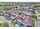 Aerial view of neighborhood with tree lined streets, green lawns and mature trees at 1008 Birkdale Trl, Winter Springs, FL 32708
