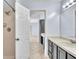 Bathroom featuring a shower, white countertop, and gray cabinets at 1008 Birkdale Trl, Winter Springs, FL 32708