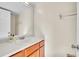 Bathroom featuring a sink with a wood-stained cabinet and a large mirror at 1008 Birkdale Trl, Winter Springs, FL 32708