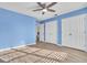 Bedroom featuring a ceiling fan, wood floors, and closet doors at 1008 Birkdale Trl, Winter Springs, FL 32708