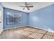 Bedroom with a ceiling fan and a large window at 1008 Birkdale Trl, Winter Springs, FL 32708