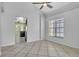 Bright dining area featuring tile floors, high ceilings with ceiling fan, and natural light from window at 1008 Birkdale Trl, Winter Springs, FL 32708
