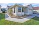 Exterior view of a home with a red tile roof, showcasing well-kept landscaping and a concrete walkway at 1008 Birkdale Trl, Winter Springs, FL 32708