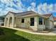 A single-story stucco home with a red tile roof, green grass, and neatly trimmed shrubbery at 1008 Birkdale Trl, Winter Springs, FL 32708