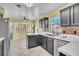 Eat in kitchen features stainless steel appliances, modern cabinets and breakfast nook bay window at 1008 Birkdale Trl, Winter Springs, FL 32708